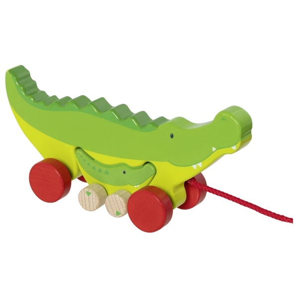 Brinquedo de madeira crocodilo verde com rodas vermelhas e cordão para puxar