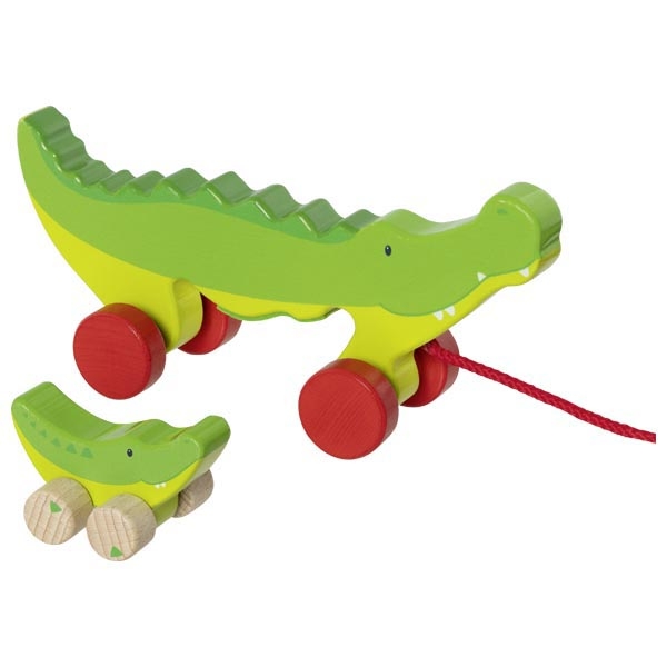 Brinquedos de madeira em forma de crocodilos verdes com rodas para puxar