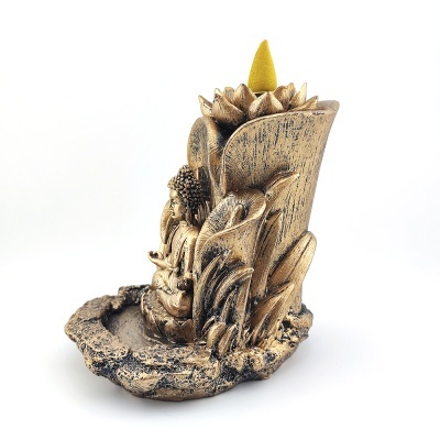 Incensário dourado em forma de flor com cone de incenso amarelo