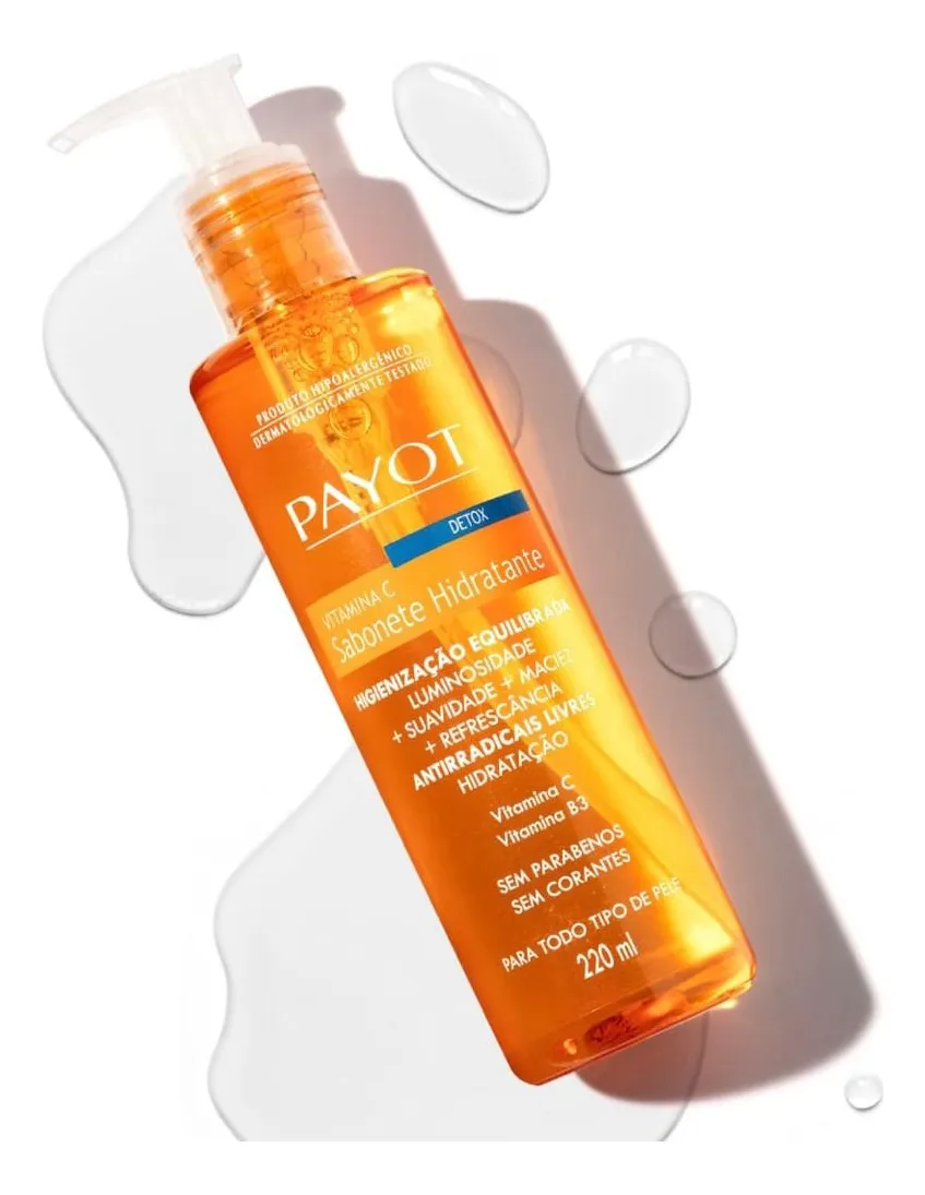 Frasco laranja de sabonete hidratante Payot com doseador branco