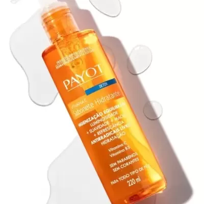 Frasco laranja de sabonete hidratante Payot com doseador branco