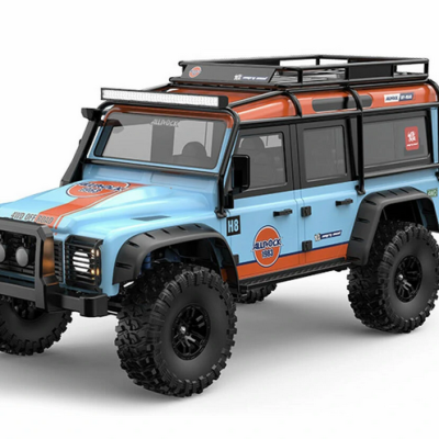 Jipe de brinquedo azul e laranja com rodas grandes e estrutura no teto