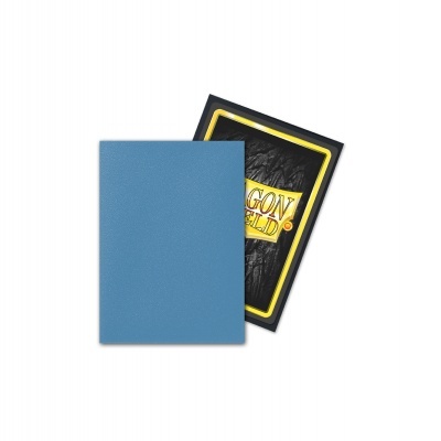 Caderno azul com capa texturizada e item preto com texto DRAGON SHIELD